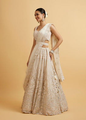 alt message - Mohey Women Dark Cream Floral Paisley Embroidered Lehenga with Round Trimmed Latkans image number 2